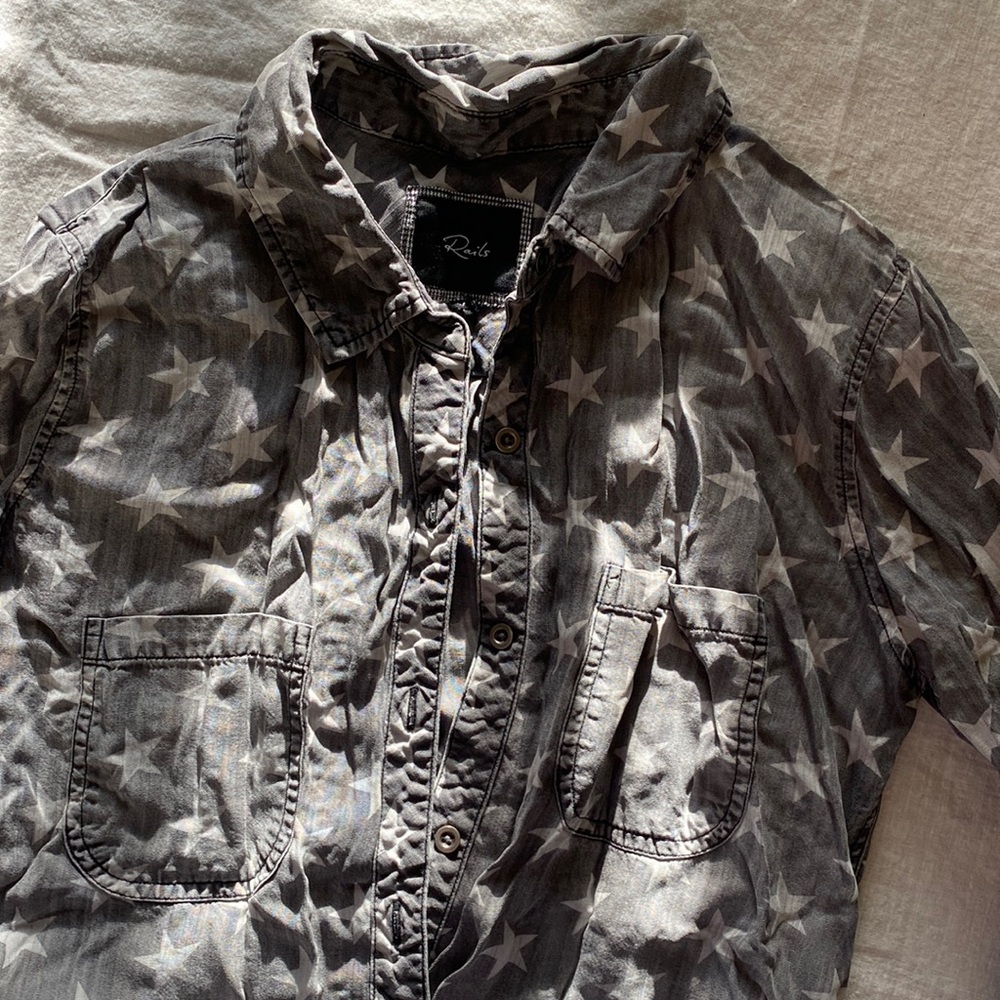 Soft denim long sleeved button up top with white stars.